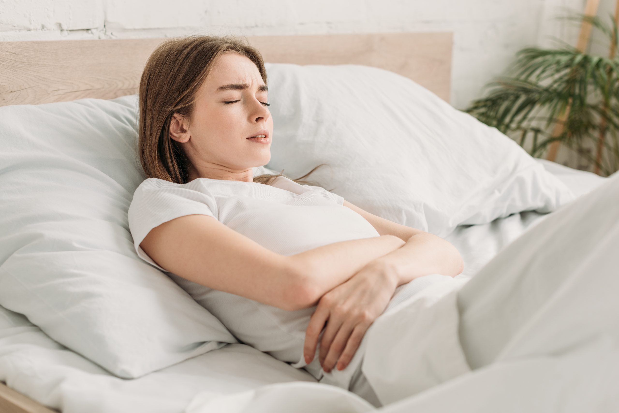 Best Side to Sleep when you have an Upset Stomach - Navien Mate